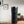 Electric Coffee Travel Mug black V2 - 355ml op tafel met digitale temperatuurweergave in moderne binnenomgeving.